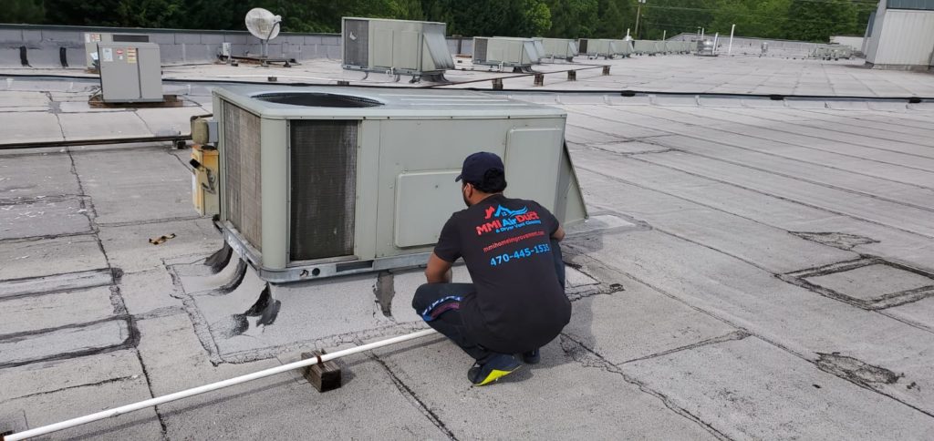 air duct repair and replacement worker
