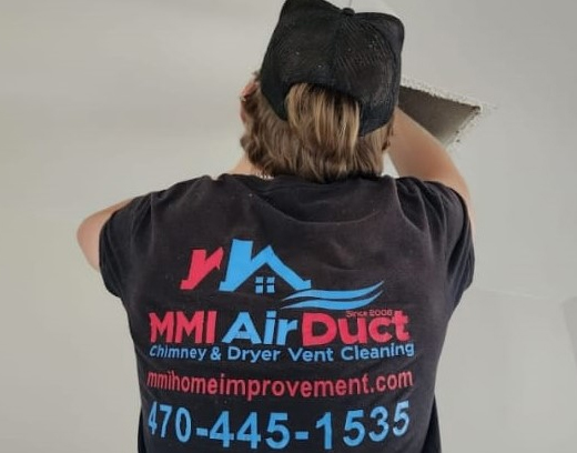 MMI Team Member doing Air Duct Sanitizing at the client's home