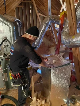 Expert-Technicians-Installing-Air-Duct-Systems-MMIHomeimprovement